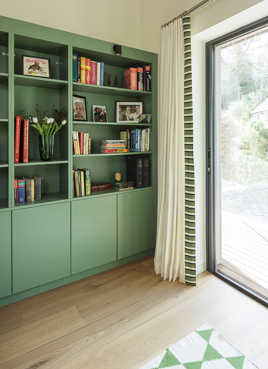 Study with green bookshelves 